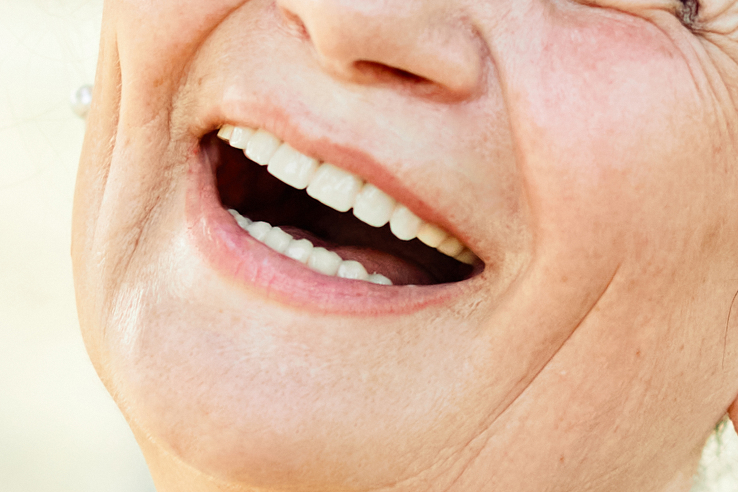 woman-senior-laughing-outside-in-green-park-2026-09-24-15-59-42-utc